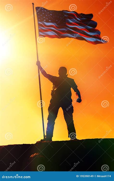 Silhouette of Man Holding US Flag American on the Mountain. the Concept ...