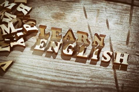 La Palabra Aprende El Inglés Hecho Con Las Letras De Madera Foto de