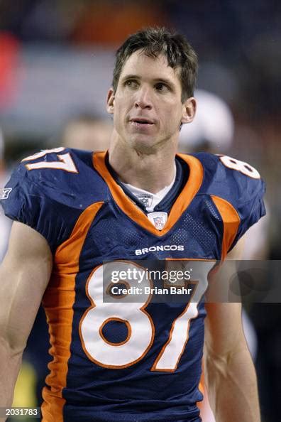 Wide receiver Ed McCaffrey of the Denver Broncos stands on the... News ...