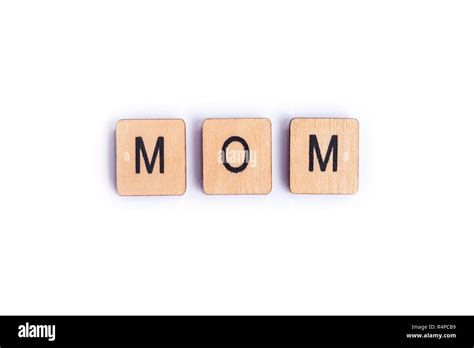 The Word Mom Spelt With Wooden Letter Tiles Stock Photo Alamy