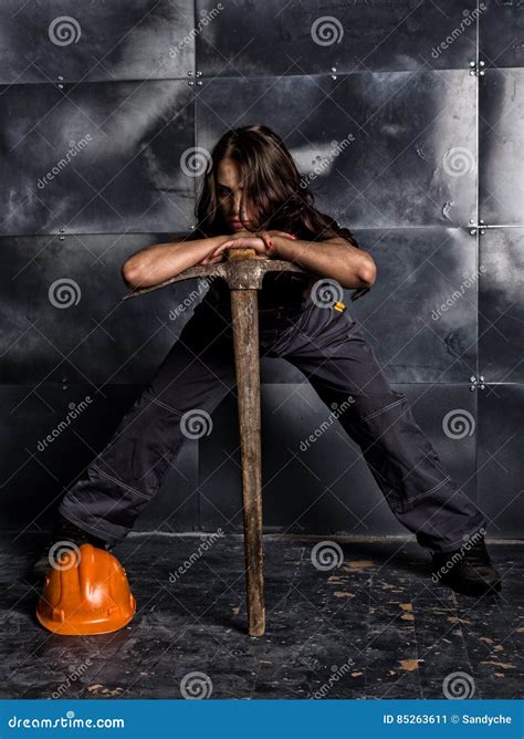 Female Miner Worker With Pickaxe In Coveralls Over His Naked Body Erotic Industry Concept