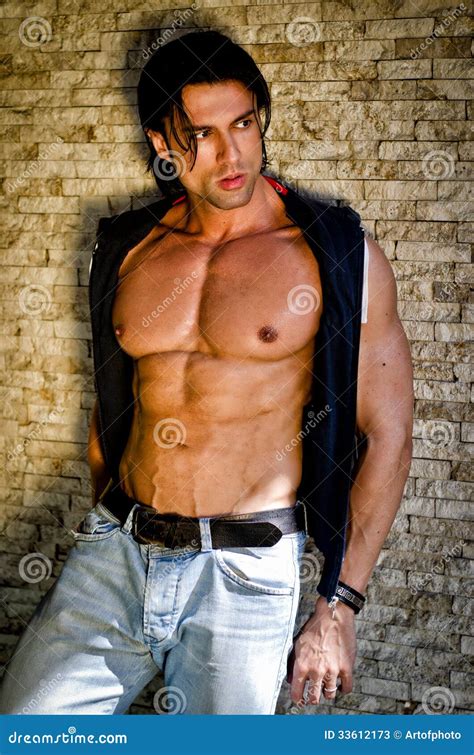 Attractive Young Man Shirtless With Jeans Leaning Against A Wall Stock Image Image Of Smile