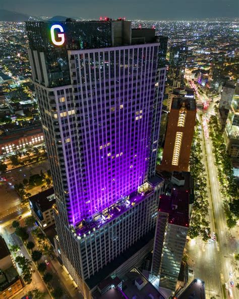 Purple Light On Skyscraper In Mexico City At Night · Free Stock Photo