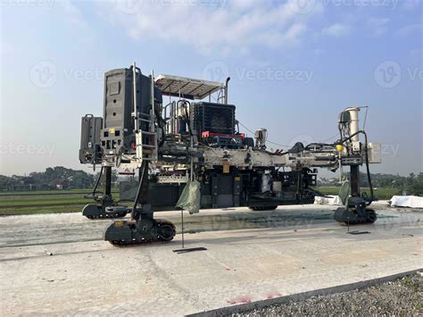 Slipform Paver Machine On Road Work At Construction Site Highway