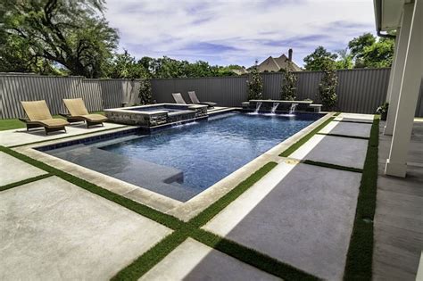 Geometric Pool With Tanning Ledge Raised Spa And Sheer Descents