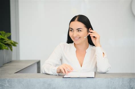 Premium Photo Portrait Of Beautiful Receptionist Near Counter In Hotel