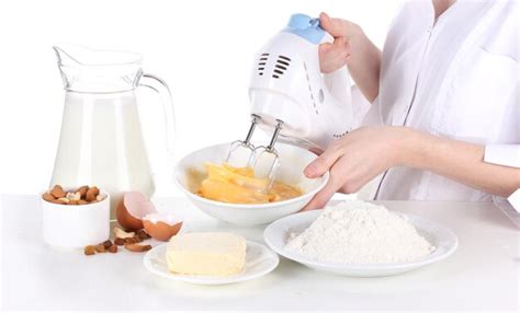 Premium Photo Female Hands Mixing Eggs In Bowl Isolated On White