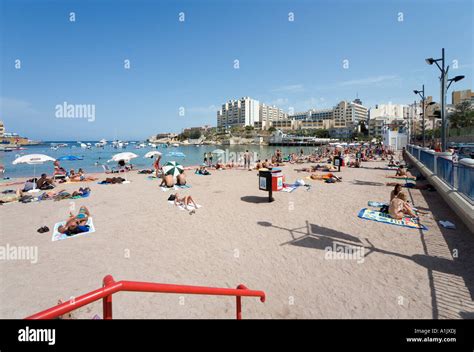 Beach at St George's Bay, Malta Stock Photo - Alamy