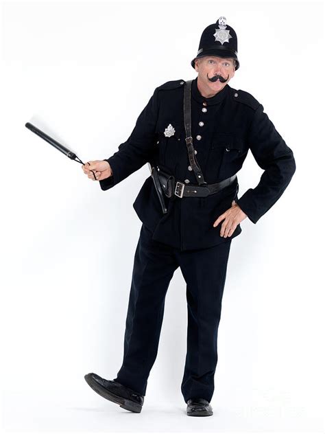 Vintage police officer with a baton Photograph by Maxim Images Prints