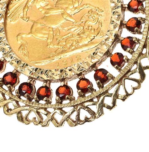 9ct Gold Mounted Full Sovereign With Garnets