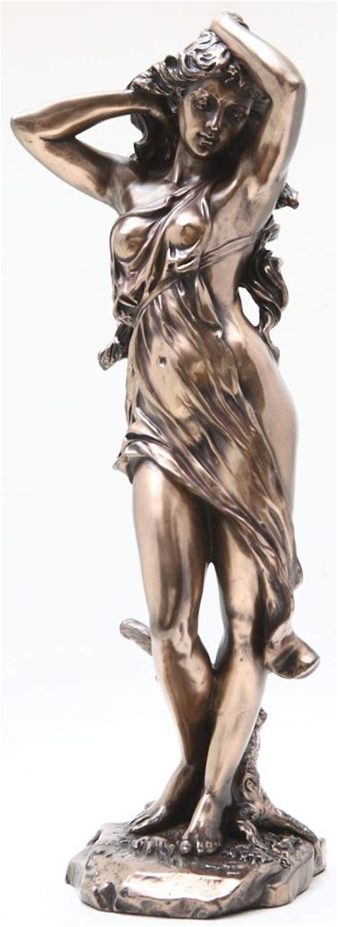 A Bronze Statue Of A Woman Holding Her Hands Behind Her Head