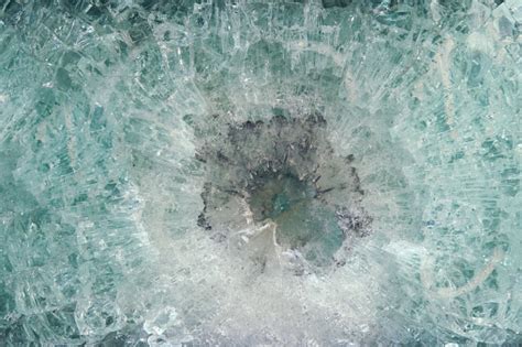 Safety Glass After Being Hit By A Bullet Texture Bulletproof Glass Car After Gunshot Background