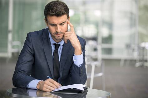 Focused Businessman Thinking And Writing Outside Office Thinking Man