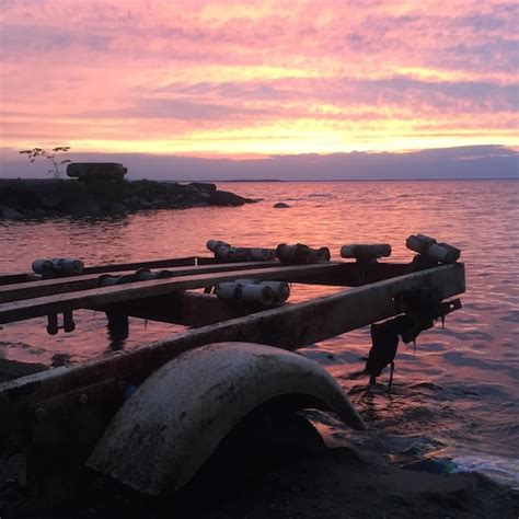 Premium Photo | Car wreck on beach at sunset