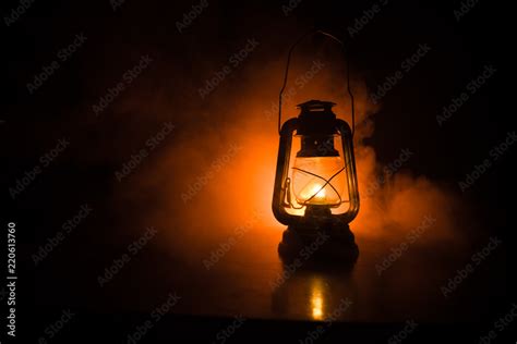 Oil Lamp Lighting Up The Darkness Or Burning Kerosene Lamp Background