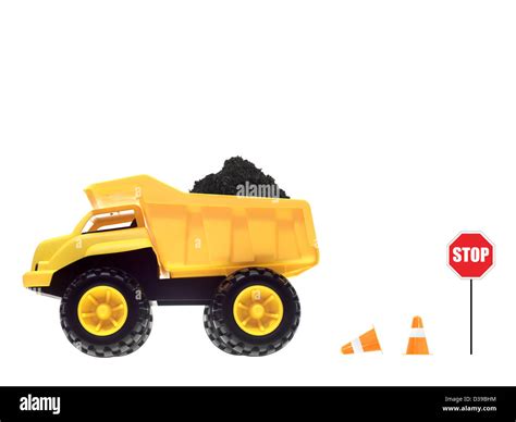 A toy dump truck isolated against a white background Stock Photo - Alamy