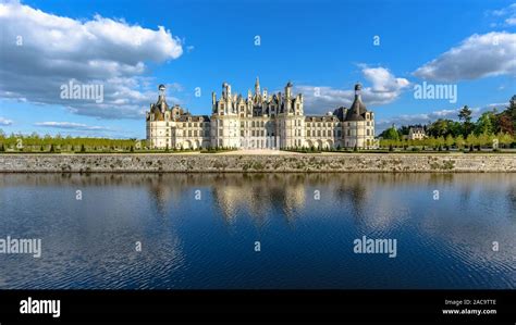 Chateau De Chambord With Its Reflection In The Moat On A Spring Day In