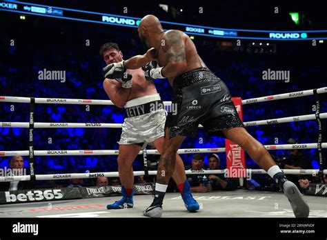 Frazer Clarke Right Strikes David Allen In The Heavyweight Bout At The Ao Arena Manchester