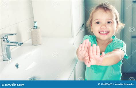 Child Girl Smiling Face Wahing And Showing Clean Hands Stock Photo