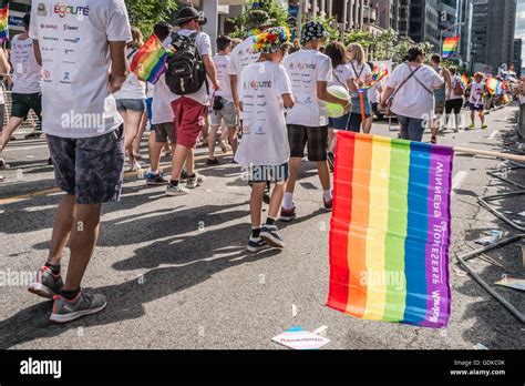 Rainbow Flag Floating In Front Of Toronto Gay Pride Participants Stock