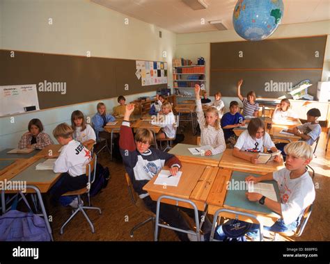 Students in 5th grade Swedish classroom sitting at desks with raised ...