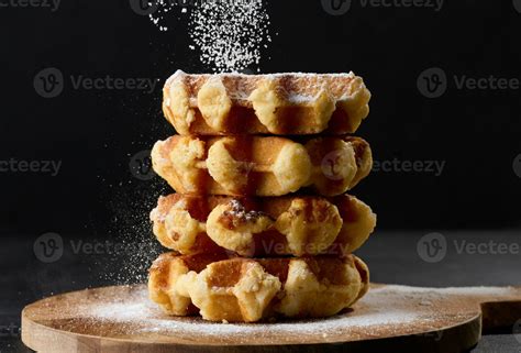 A Stack Of Baked Belgian Waffles Sprinkled With Powdered Sugar 32041632