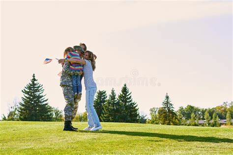 Happy Reunion of Soldier with Family Outdoors. Stock Photo - Image of ...