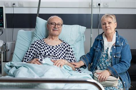 Premium Photo Elderly Woman Visiting Sick Husband In Hospital Room