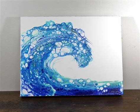 a painting with blue and white swirls on the bottom is displayed in ...