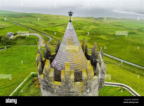 Aerial view of Doonagore Castle, round 16th-century tower house with a ...