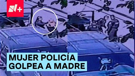 Se hace viral video de mujer policía golpeando a madre enfrente de sus