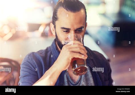 Happy Man Drinking Beer At Bar Or Pub Stock Photo Alamy