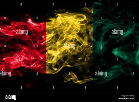 National Flag Of Guinea Made From Colored Smoke Isolated On Black Background Abstract Silky