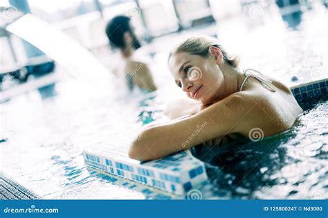 Portrait Of Beautiful Woman Relaxing In Swimming Pool Stock Image