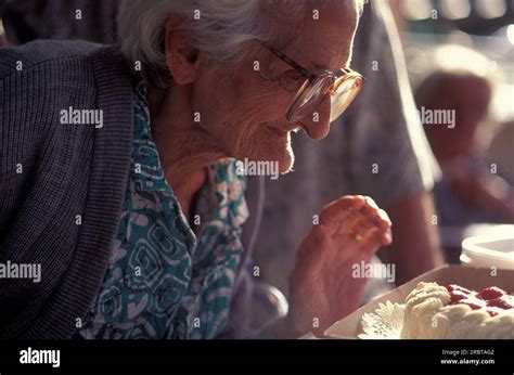 Old lady celebrating with a birthday cake Stock Photo - Alamy