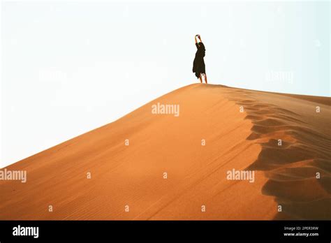 Woman Enjoy Sand Dunes Top In Desert Stretch Arms Pose Travel Lifestyle And Wellness Concept