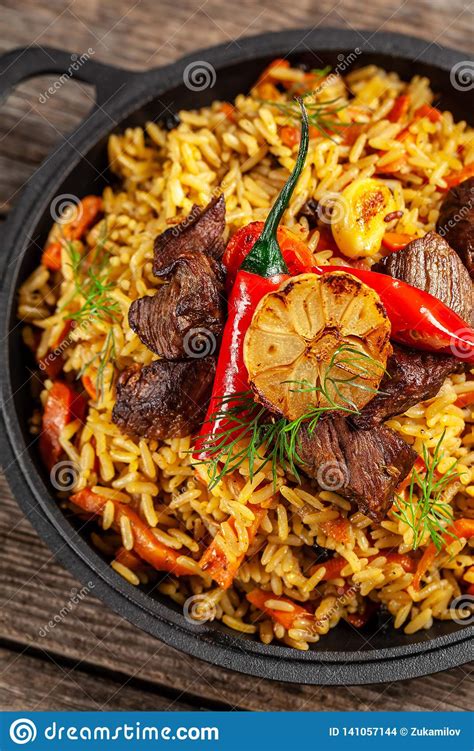 The Concept Of Oriental Cuisine National Uzbek Pilaf With Meat In A