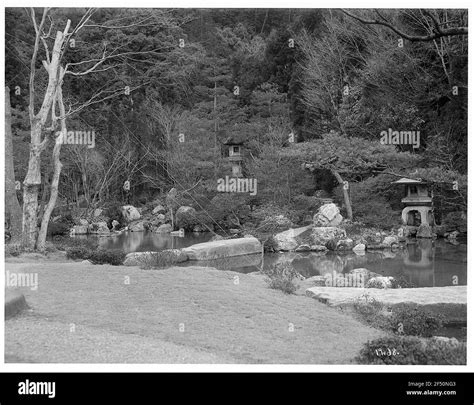 Kyoto. Garden with pond and stone lanterns Stock Photo - Alamy