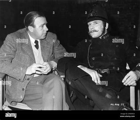 Producer Ronald Neame And Laurence Olivier In Costume As Police