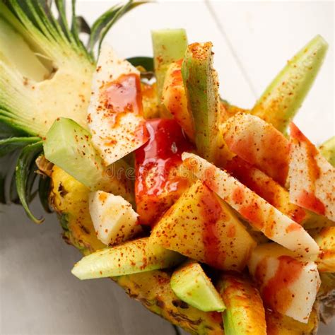 Cucumber Jicama And Pineapple With Chili Powder And Chamoy Sauce On