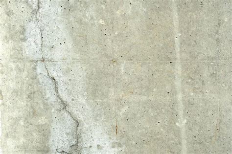 Premium Photo Cracked Concrete Wall Covered With Gray Cement Surface