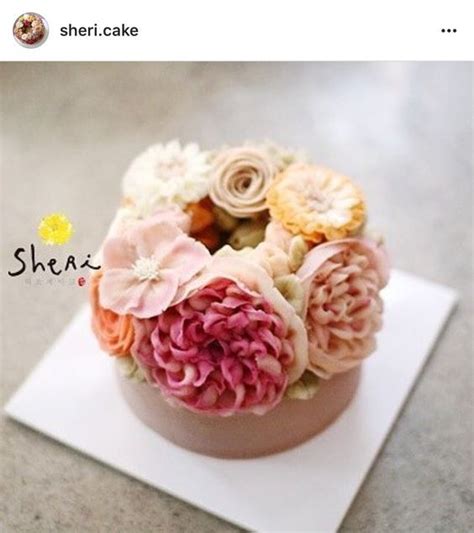 There Is A Small Cake With Flowers On It