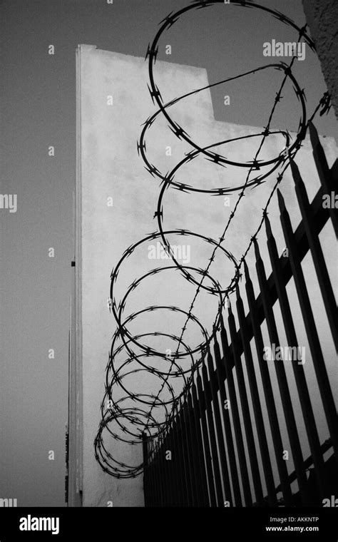 Security Fence With Razor Wire Stock Photo Alamy