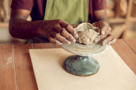 Close Up Picture Of A Mans Hands Molding A Shape Of The Clay Mug Stock