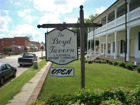 A Sign For The Boyy Tavern And National Historic Landmark Open In Front