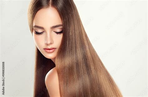 Beautiful Model Girl With Shiny Blonde Straight Long Hair Care And