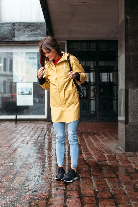 Beautiful Brunette Woman Posing On The Street In Cold Rainy Wether By Stocksy Contributor