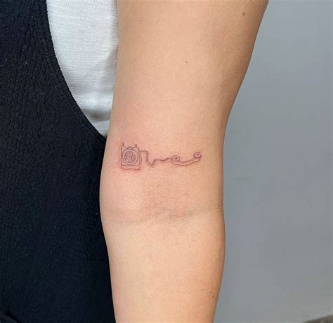 Single Needle Telephone Tattoo On The Bicep