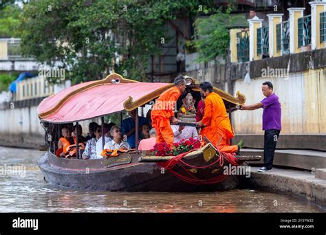 Hindu Priests From Gurudeva Ashram Are Lowering The Clay Idol Of Lord