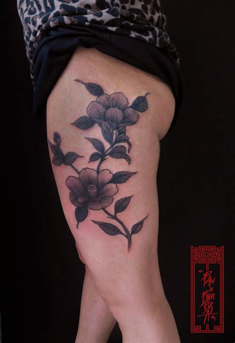 A Woman S Leg With Flowers On It